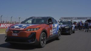 Subaru’s electric Uncharted makes UK debut as WorldSBK safety car Two Subaru Uncharted safety cars, one orange and one black, both in "Subaru Safety Car" and SBK livery, lined up on the pit lane at Donington Park with spectators and Prosecco DOC branding in the background.